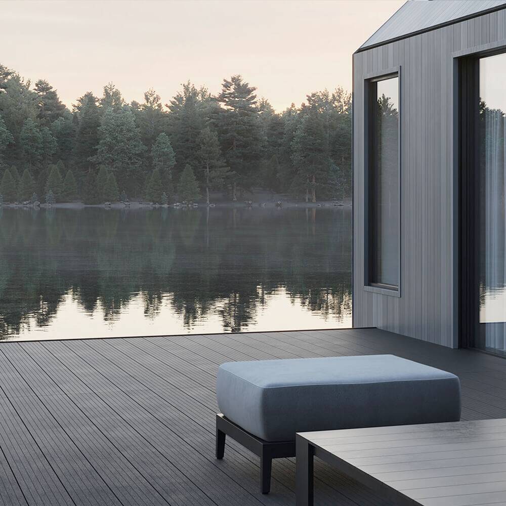Dark composite decking beside a lake