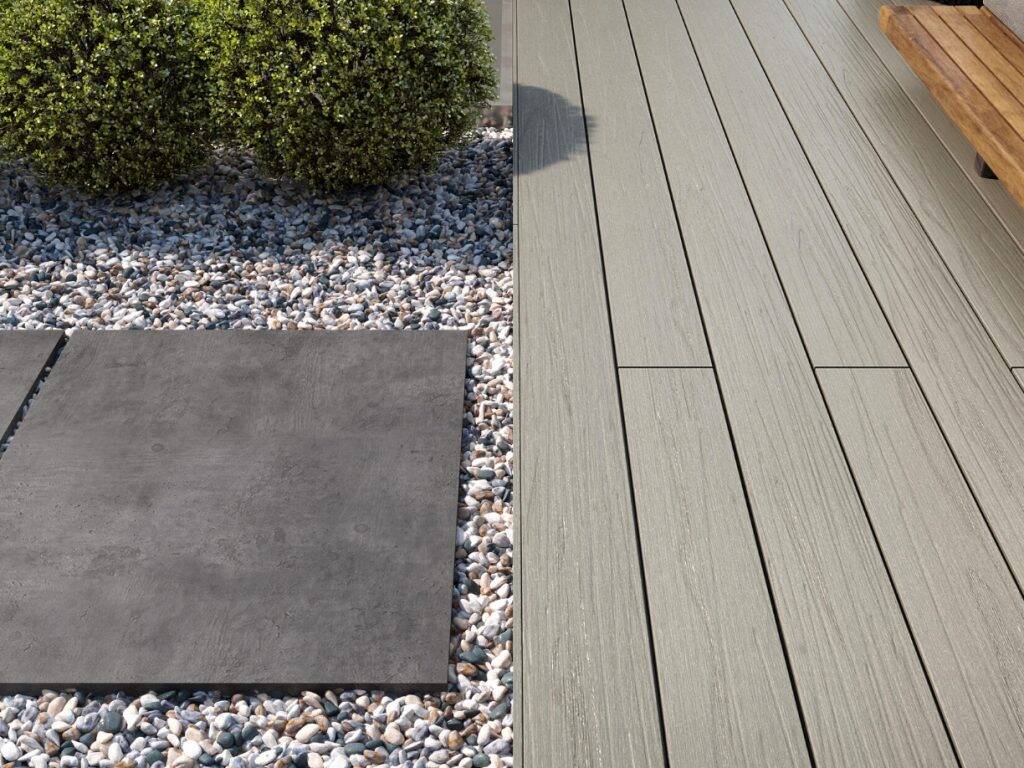 Forma Flint composite decking with pebble borders