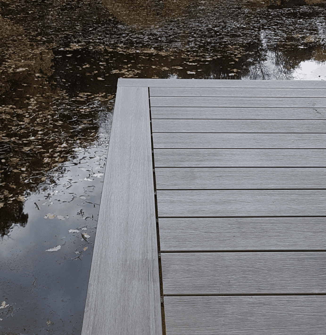 Argent composite decking by the water