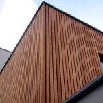 Vertical composite cladding on the corner of a modern building