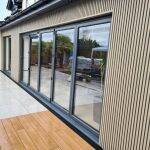 Silver Birch slatted cladding framing large glazed doors