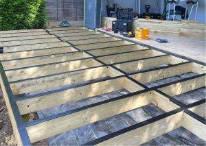 Waterproofing tape fitted along decking joists